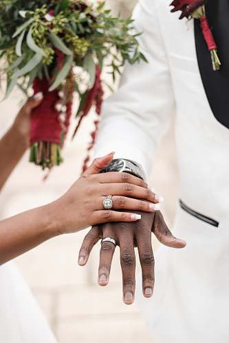 person woman holding the man's hand finger