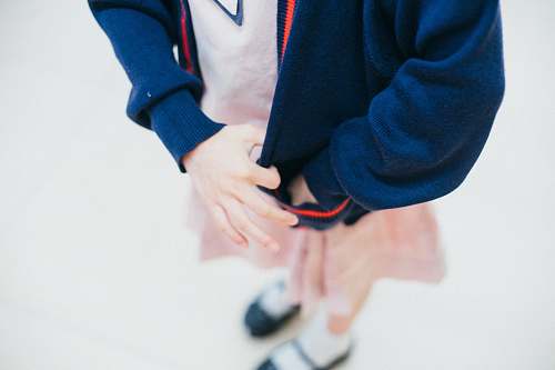 person woman tugging her blue jacket people