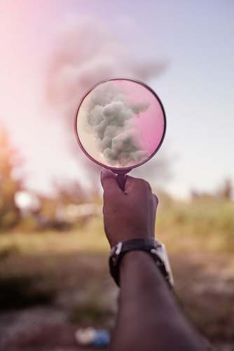 bubble magnifying glass showing smoke sky