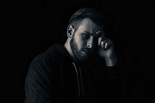 male man leaning his face on his right hand guy
