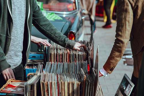 records person selling vinyl album in street lewis cubitt square