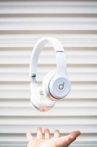 headphones white Beats by Dr. Dre headphones on mid air white
