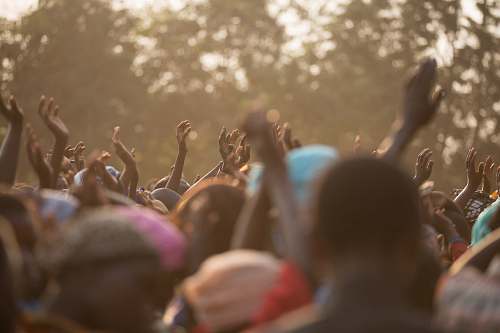 hands people dancing during daytime crowd