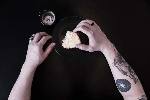 human person holding bread person