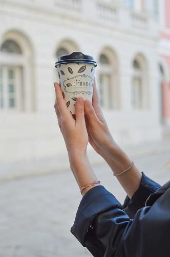 person person holding cup human