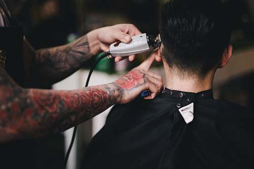 human person using white hair clipper person
