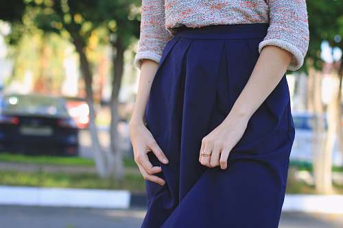 people close-up photography of woman wears blue skirt at daytime girl