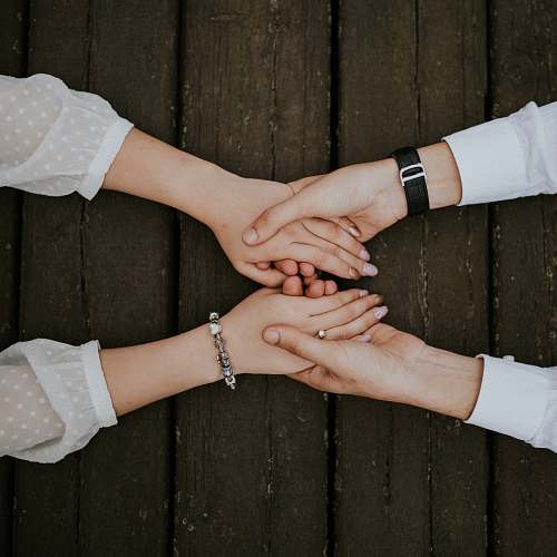 human flat lay photography of man and woman holding hands together people