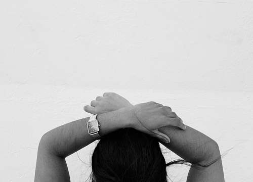 human grayscale photography of person holding hands black-and-white
