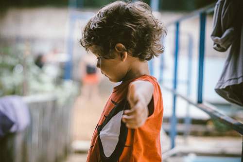 human kid wearing deadpool shirt kid