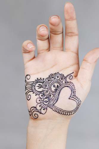 human left person's hand with tattoo tattoo