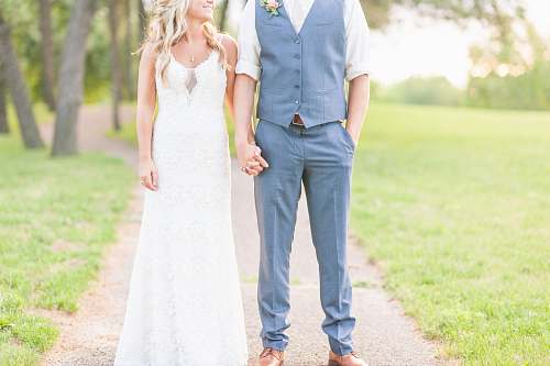human man and woman holding hands during daytime people