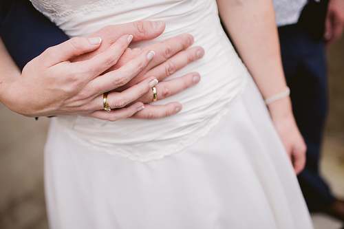 human man embracing woman waist people