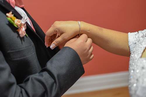 human man in gray suit finger