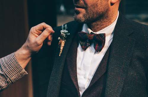 human man wearing black suit jacket people