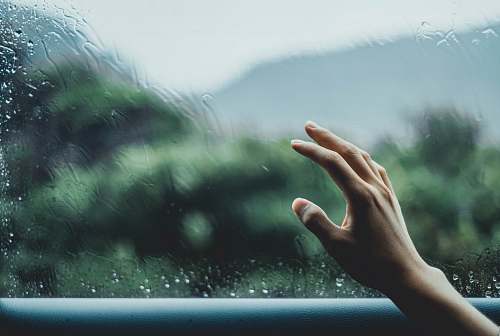 human person about to touch glass finger