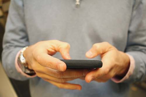 hand person holding black smartphone human