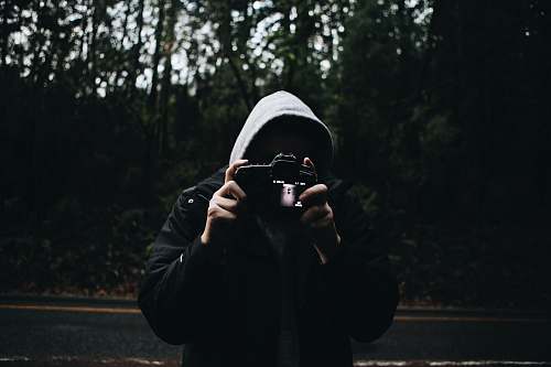 human person holding camera people