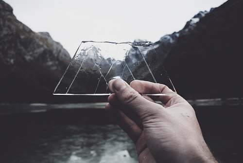 human person holding clear glass panel new zealand