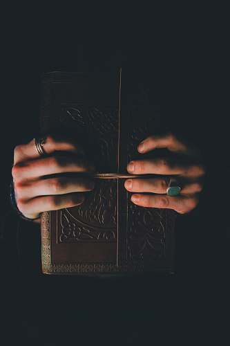 human person holding hardbound book people