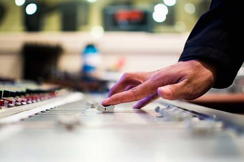 human person holding mixing console music