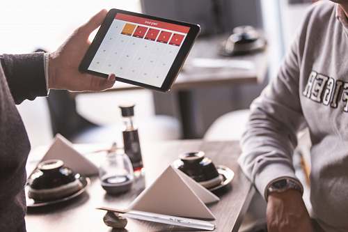 people person holding opened space gray iPad human