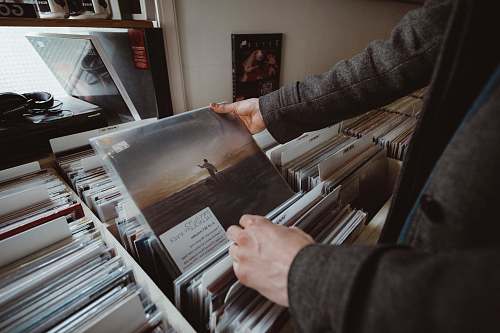human person holding vinyl album people