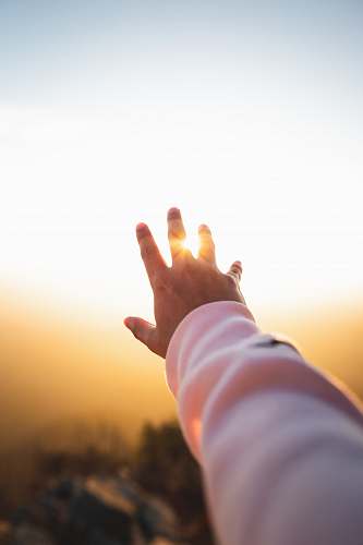 light person lifting hand flare