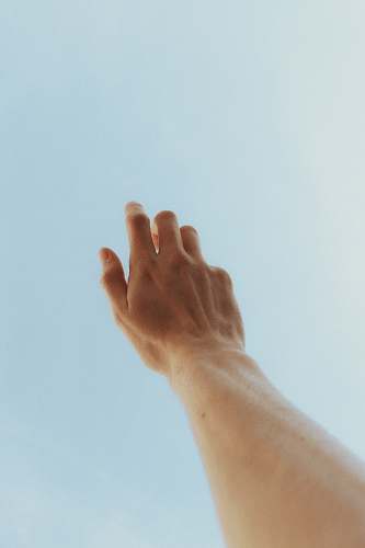 human person raising left hand finger