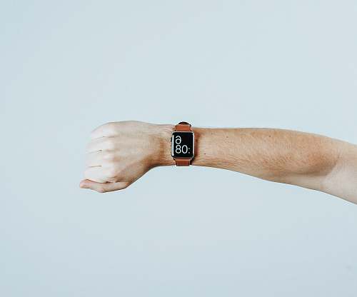 minimal person wearing Apple watch finger