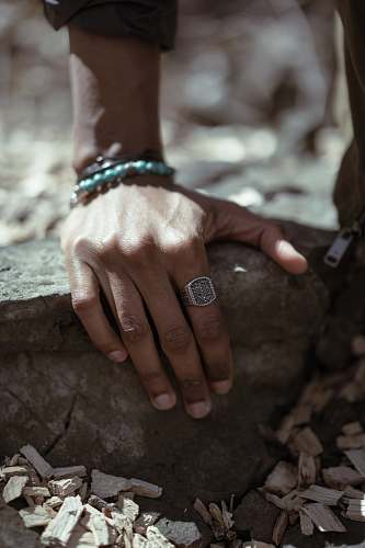 human person wearing ring and bracelet finger