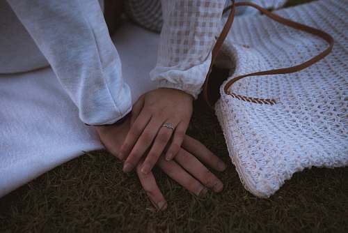 human person wearing white shirt inside well lit room hand