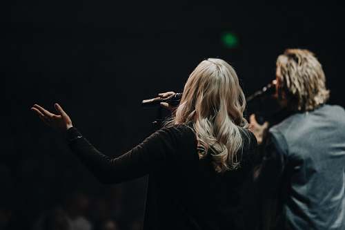 human photo of singing man and woman people