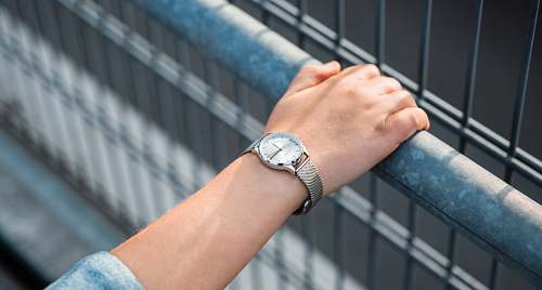 human round silver-colored analog watch with link bracelet wristwatch