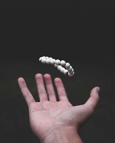 human shallow focus photo of beaded white bracelet people