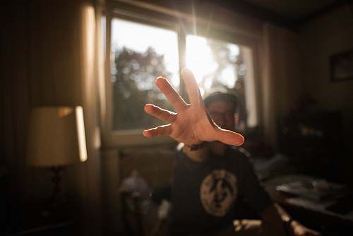 hand shallow focus photography of man hand clock