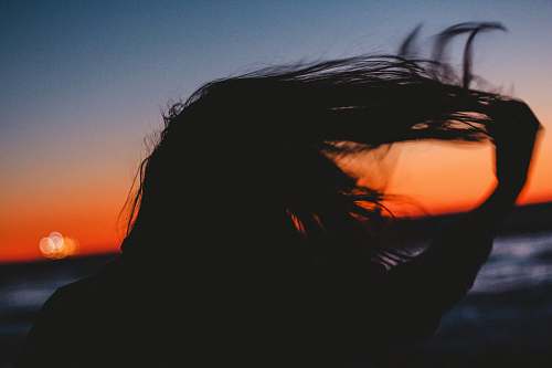 woman silhouet photo of woman hair water