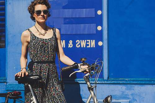 people woman holding gray bicycle bicycle