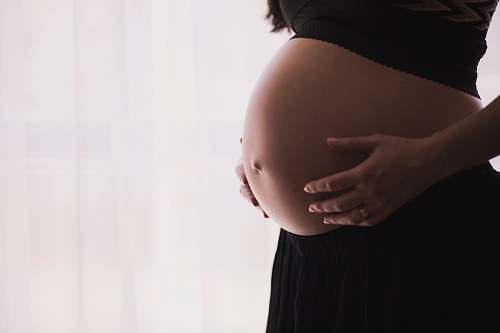 baby woman holding stomach pregnancy