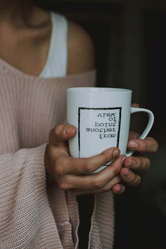 human woman holding white ceramic mug people