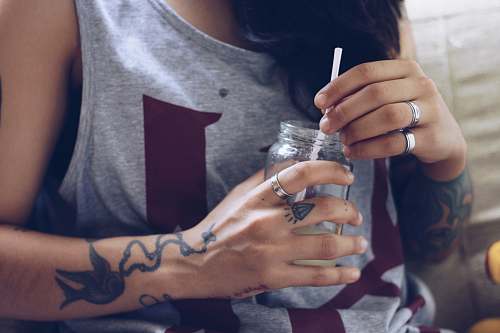 human woman sitting holding bottle people