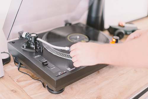 player person playing turntable record player