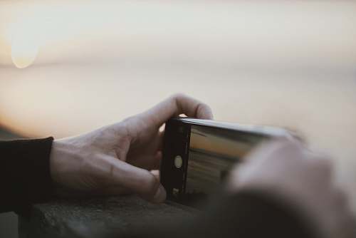 iphone person taking a photo using smartphone photographer
