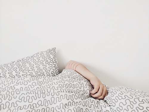 minimal person lying on bed sleep