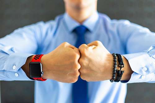 accessories shallow focus photo of person wearing black smartwatch accessory
