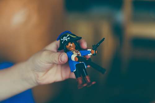 playmobil person holding Pirate figure pirate