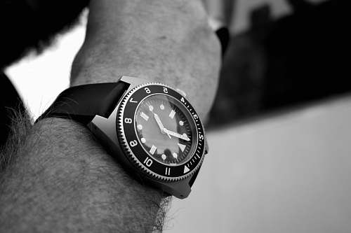 black-and-white grayscale photography of analog watch wristwatch