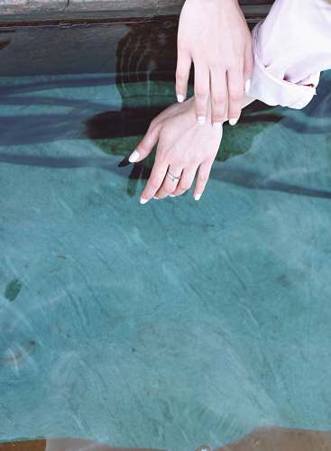 hand person wearing silver-colored ring nail
