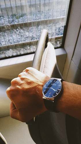 banister round blue and gold-colored analog watch handrail