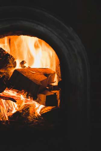 flame burned woods in fireplacfe fireplace
